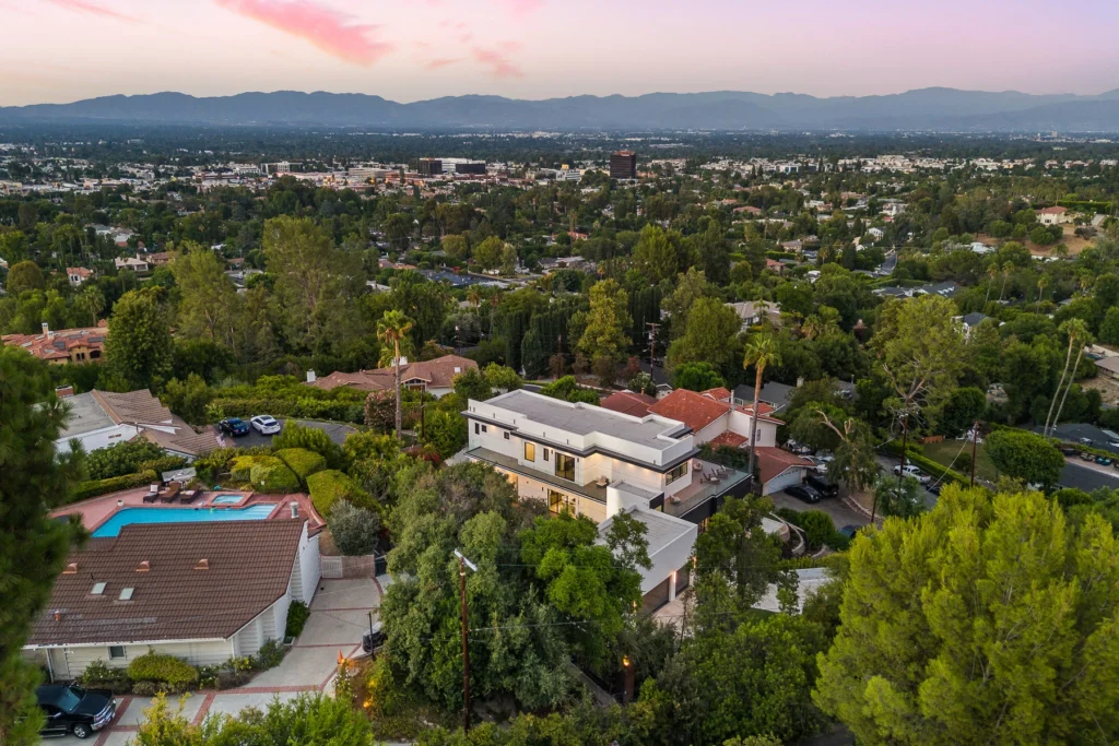 Twilight aerial drone photography of residential property
