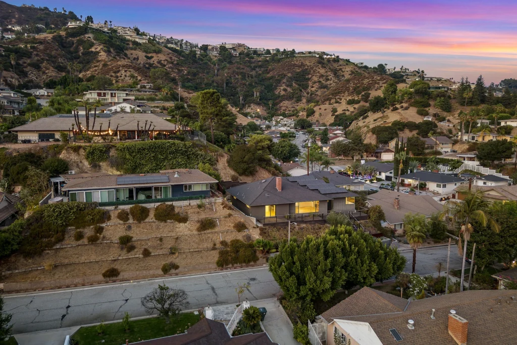 Twilight aerial drone photography of residential property